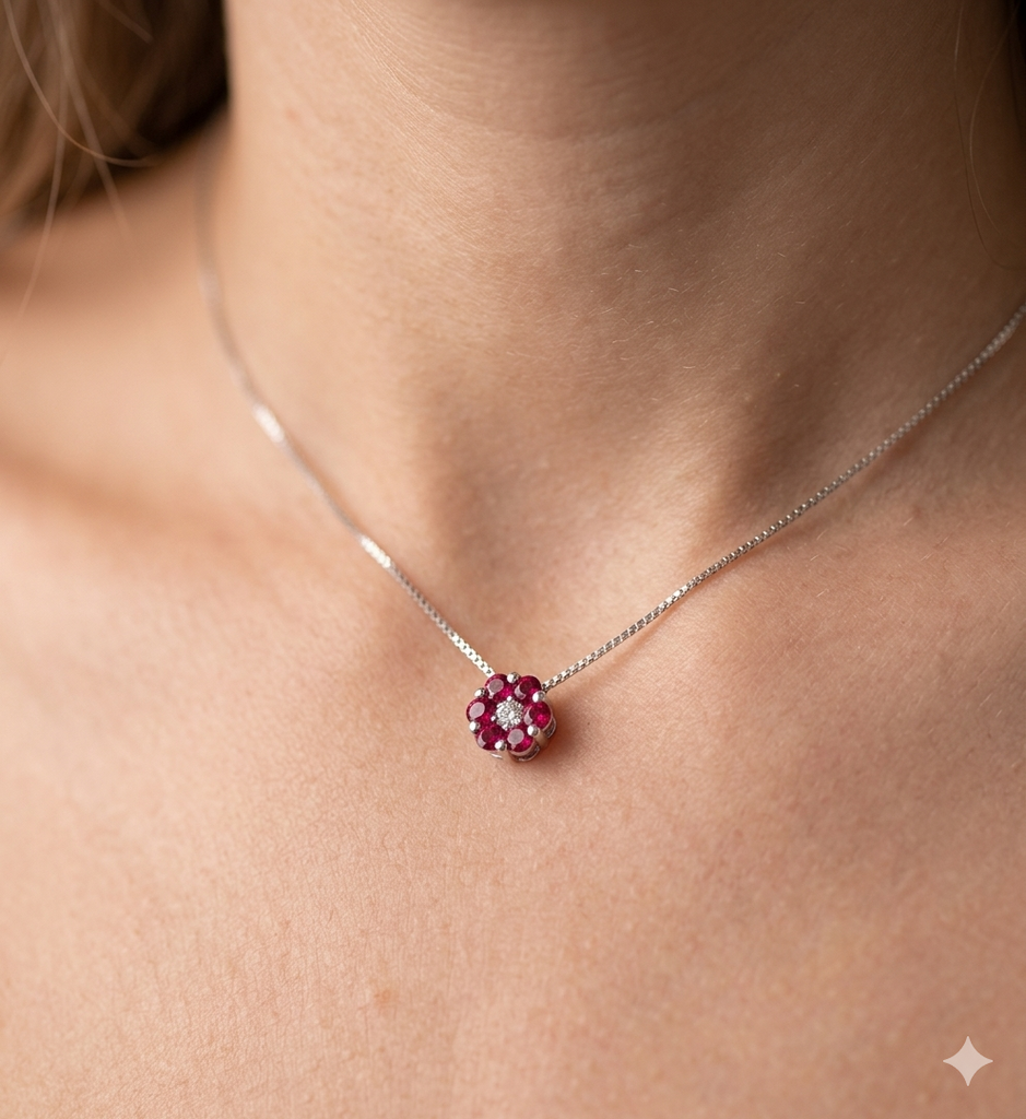 Collana modello Fiore in Oro 18 Carati con Brillante e Rubini.
