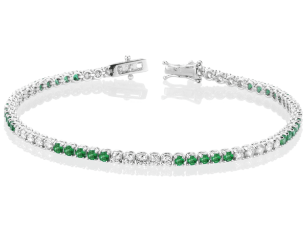 Bracciale modello Tennis in Oro 18 Carati con Diamante e Smeraldi.
